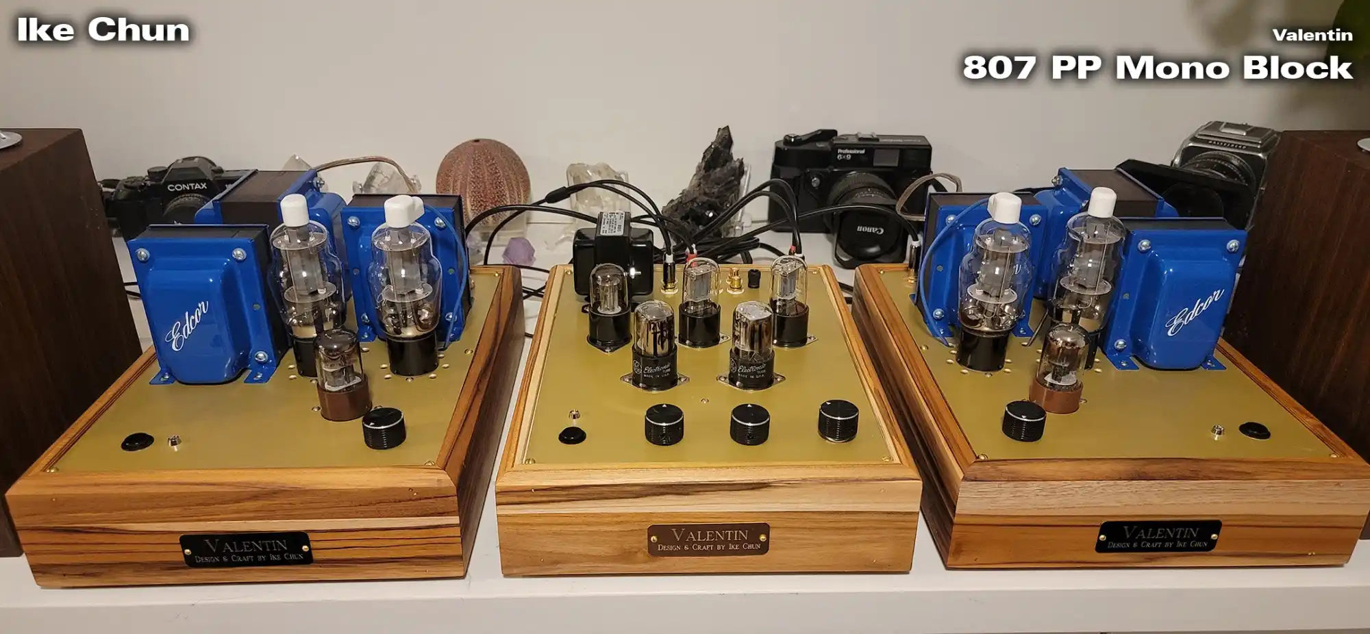 807 pp mono block amplifier with wooden enclosure and blue power supply.