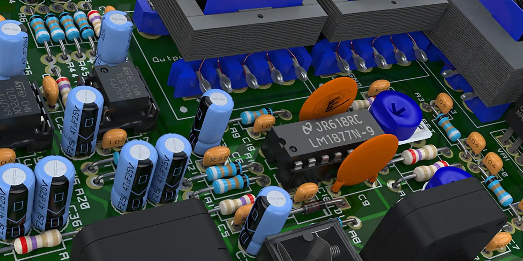 Circuit board with blue capacitors and orange resistors.